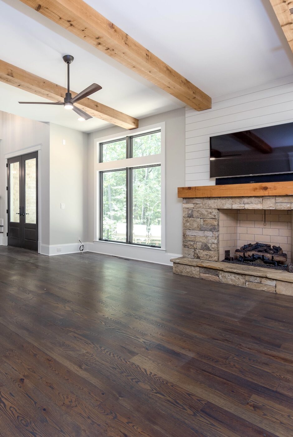 living-room-design-dark-wood-floors-wood-beam-ceiling